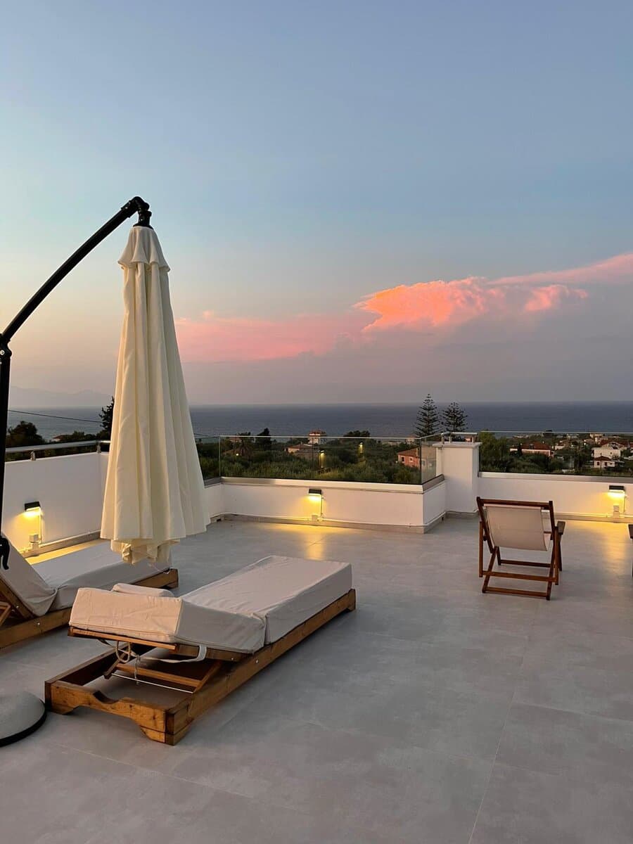 Rooftop terrace at sunset with sea view