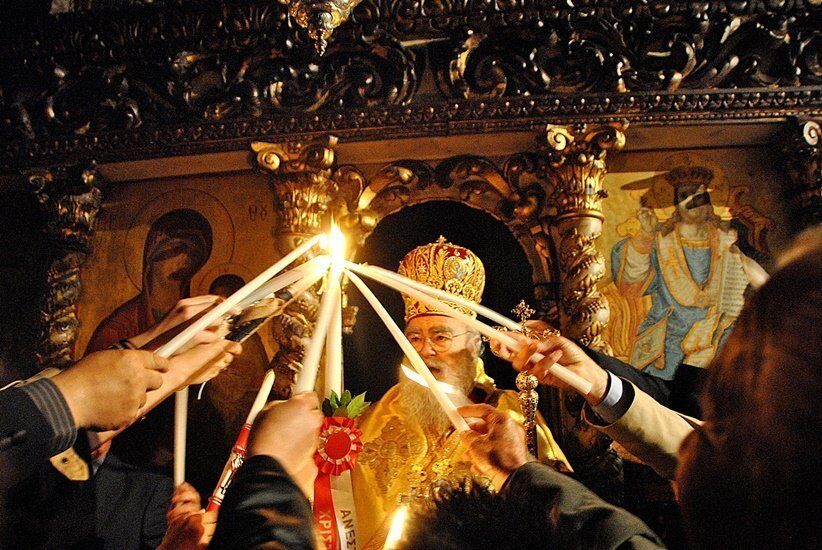 Midnight Resurrection — the Holy Light passed from candle to candle inside the church