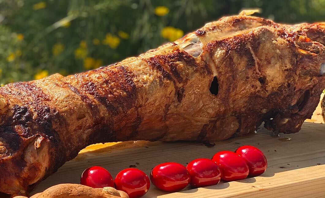 Easter Sunday lamb on the spit with red-dyed eggs — the traditional Greek Easter feast