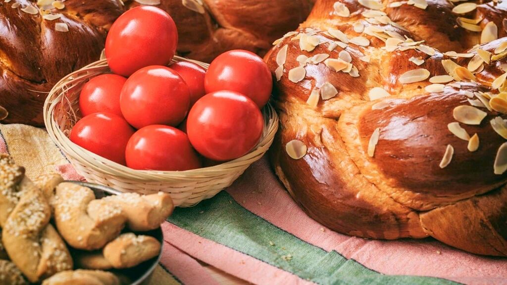 Traditional Greek Easter red eggs and tsoureki bread