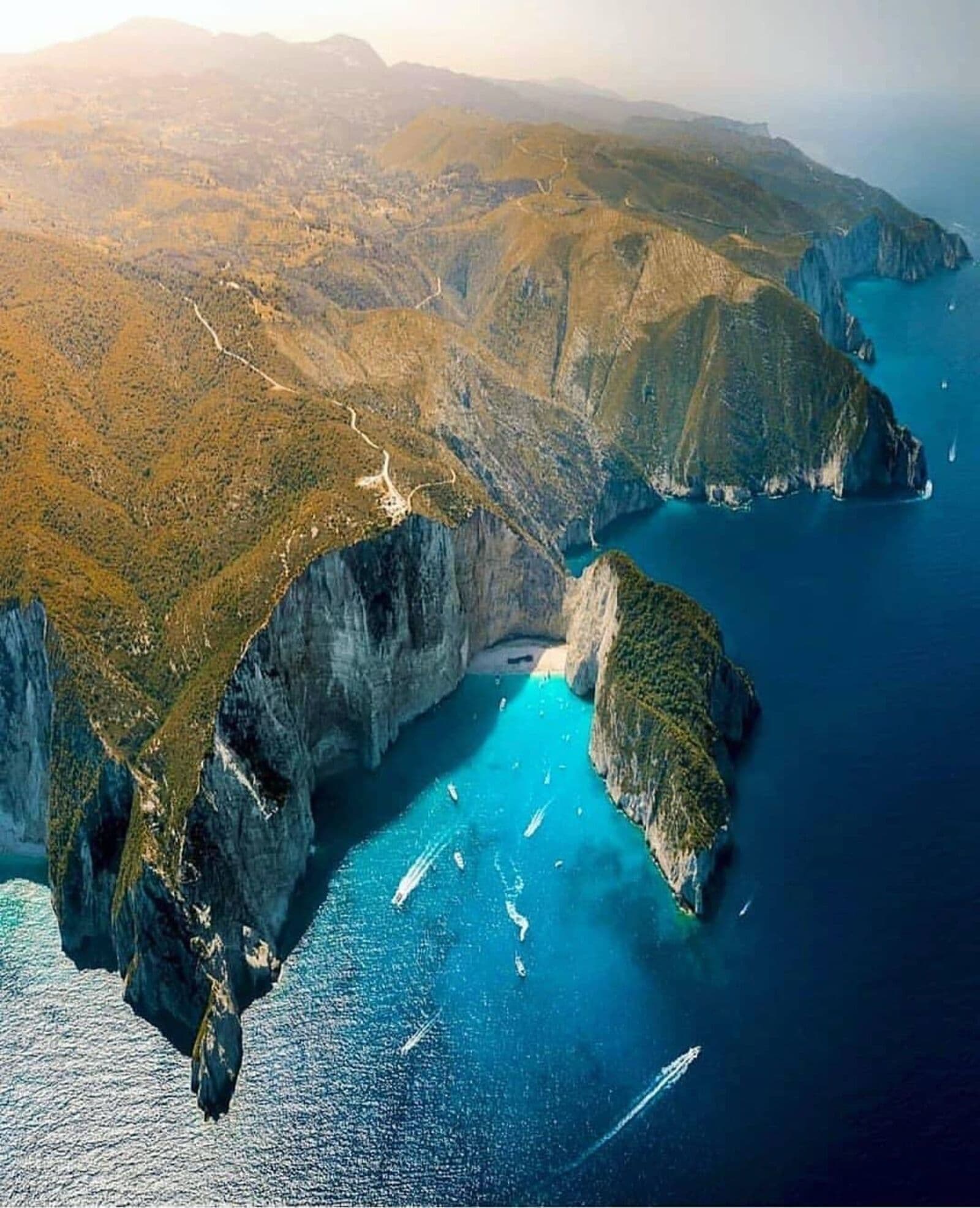 High-altitude aerial view of Navagio Beach and the surrounding coastline